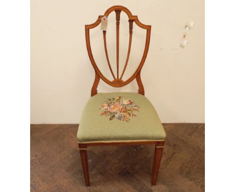 An Edwardian satin wood shield back mahogany dining or occasional chair with floral tapestry seat 