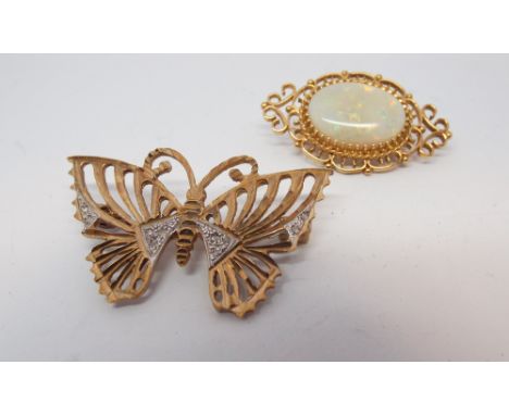 9ct yellow gold framed oval opal set brooch and a butterfly brooch