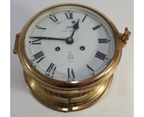 Circular brass ships clock with striking movement, approx 6" diameter 