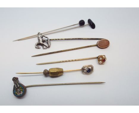 A collection of six Victorian and later stick pins to include 14k white gold and sapphire pin 