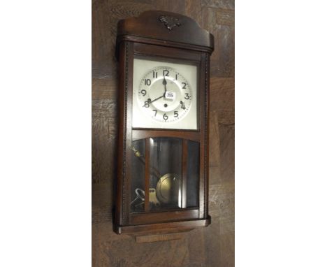 1930s chiming wall clock in oak and glazed case 
