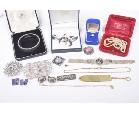 A selection of silver and costume jewelleryTo include a silver buckle, a silver bangle, together with various costume jewelle