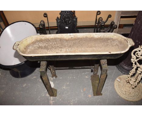 A Late 19th early 20th Century French Chappee iron trough raised upon substantial iron uprights, 112cm. 