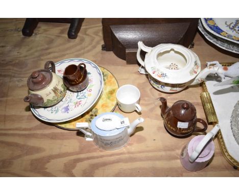 A collection of various teapotsIncluding Chinese example, German example, Welsh example; together with various plates includi