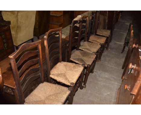 A matched set of six 18th/19th Century ash ladder back kitchen chairsEach chair with a ladder back above an envelope rush sea