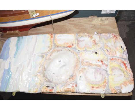 A large ceramic plaque by Angela Sinclair - Jones Of rectangular shape, painted in colourful tones. 