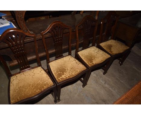A set of four Chippendale style mahogany dining chair, early 20th Century each with a pierced splat back. 