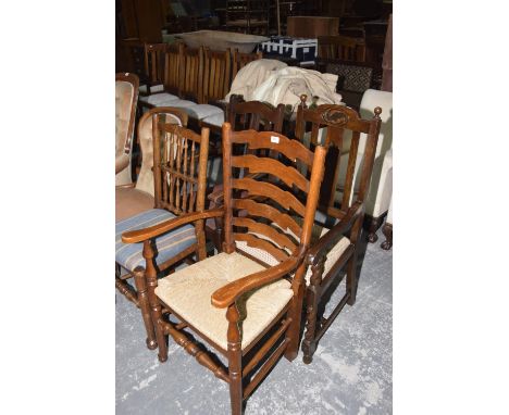 Four assorted Oak chairs, to include an oak ladder back elbow chair. 1920's Oak lath back elbow chair. Second similar chair a