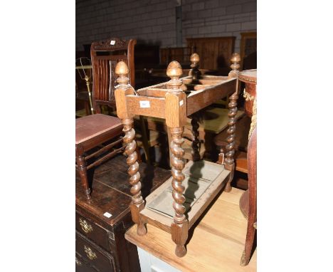 A 1930's oak barleytwist four section stick stand.Condition - Heavy rubbing/wear to the top section dividers. 55 x 74 x 25cm 