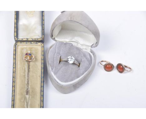 A selection of jewellery To include a sapphire, ruby and split pearl stickpin, a pair of carnelian earrings and a paste singl