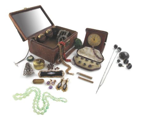 A lady's leather travel case containing: a cased set of Victorian gold buttons and dress studs (one missing) designed as serp