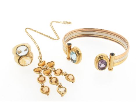 An amethyst and blue topaz bangle, the tricolour gold open bangle of fluted columnar design with cabochon sapphires to the ab