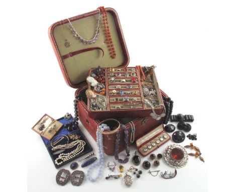 A large leather jewellery box containing: a citrine mounted gold ring, a gold wedding band, a diamond bar brooch, an opal mou