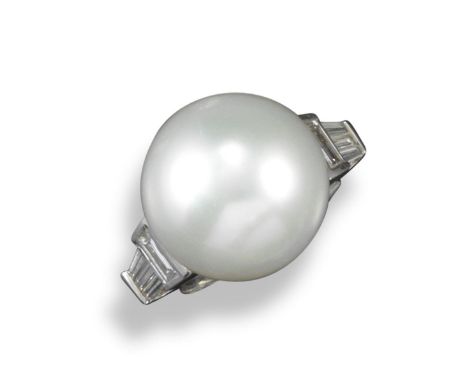 A cultured pearl and diamond ring, the large white pearl is approximately 16mm diameter, set with three baguette-shaped diamo