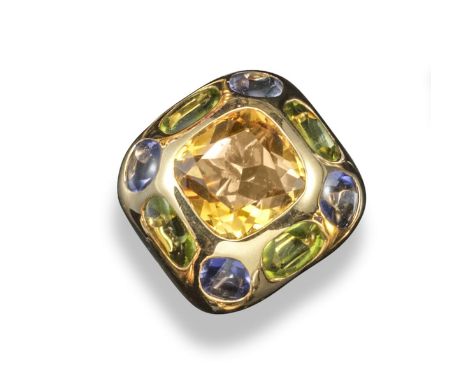 A gem-set dress ring by Chanel, set with a central cushion-shaped citrine within an alternating border of peridot and tanzani