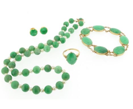 A gold mounted jade bracelet, set with oval-shaped jade cabochons, a jade bead necklace, a jade cabochon mounted gold ring an
