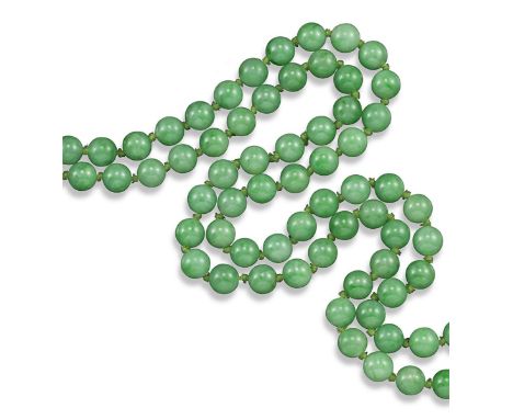 A long jade bead necklace, the beads measure approximately 9.5mm. 125cm long.