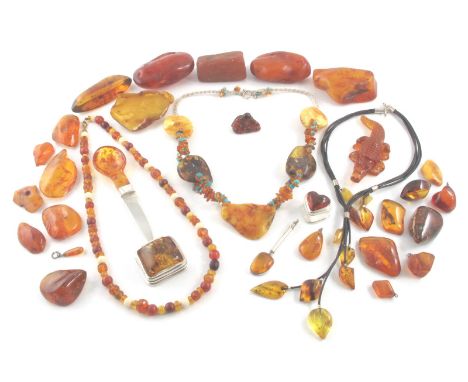 Various items of amber, including two amber-mounted silver boxes, a silver knife mounted with a spoon-shaped amber handle and