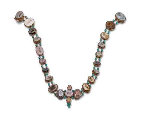 An early 19th century necklace mounted with twenty three assorted carved hardstone intaglios, mounted in gold claw-set cut do
