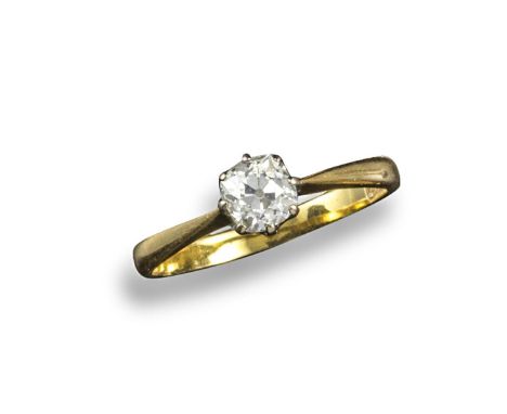 A diamond solitaire ring, the old cushion-shaped diamond is set in platinum and yellow gold. Size O. Case.