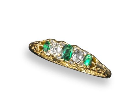 A late Victorian small emerald and diamond half hoop ring, set with three emeralds and two cushion-shaped diamonds in 18ct ye