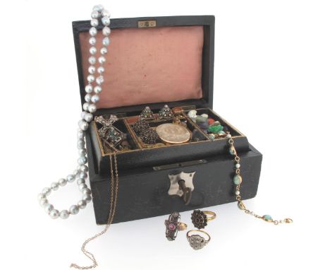 A leather jewellery box containing various items of jewellery including: a cultured pearl necklace, a ruby and diamond-set ab