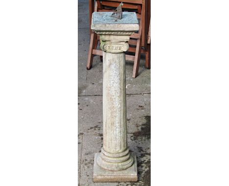 A garden sundial with square plate and pierced gnomon, raised on a cast composition stone classical fluted Doric column, 92cm