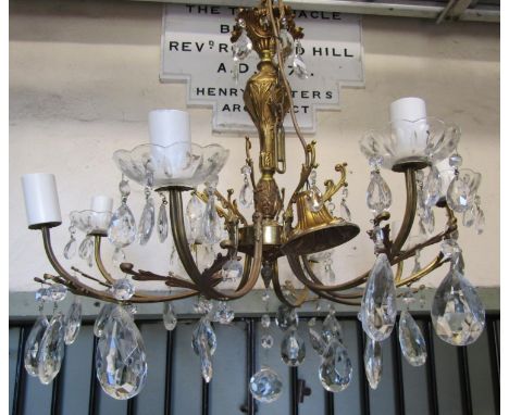 A cast gilt metal eight branch chandelier with acanthus detail and faceted tear drops 60 cm drop approximately (measurement e