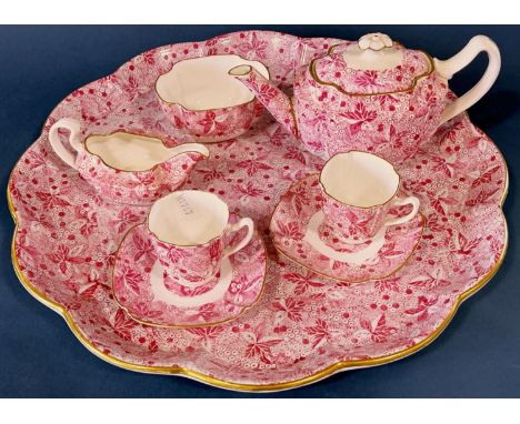 A Copeland Spode tea service with all over floral pink decoration and gilt highlights comprising large serving tray, teapot, 