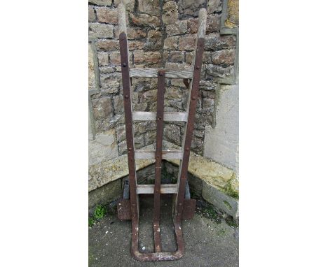 A vintage heavy gauge wooden sack truck with iron fittings, labelled Made by F Parr, Dean Street Birmingham (af) 