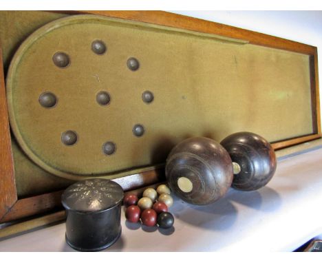 A vintage table top bagatelle board a selection of nine different coloured balls, one cue, together with two vintage wooden b