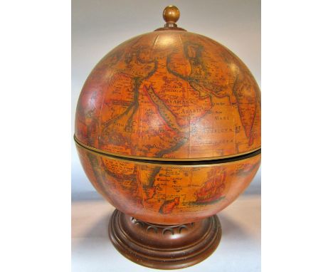 A drinks cabinet in the form of an 18th century Terrestrial Globe with a hinged equator opening to reveal the interior upper 