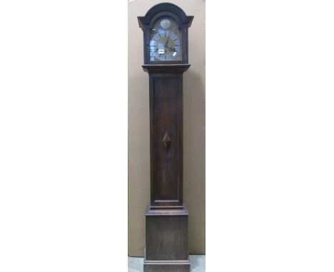 An Edwardian/1920's grandmother clock, the oak case with applied split mouldings and arched hood enclosing a brass and silver