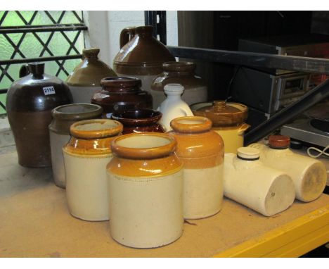 Collection of vintage glazed stoneware flagons, jars and hot water bottles of varying size and capacity, mainly unmarked 