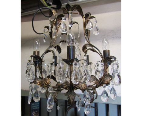 A contemporary light metal chandelier with five candle bulb fittings scrolling leaf detail, faceted tear drops, 60 cm drop ap