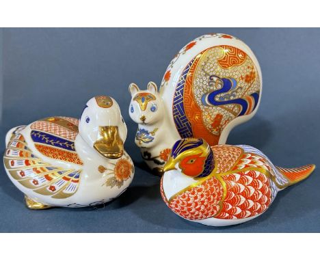 A collection of Royal Crown Derby ornaments to include a squirrel, a pheasant and a duck, with button to base 