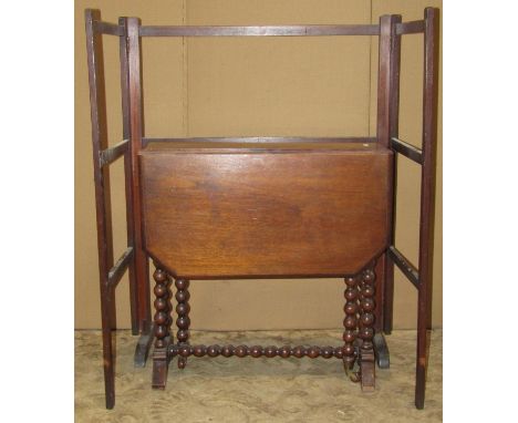 Victorian walnut drop leaf Sutherland type tea table raised on turned bobbin supports, together with a small Victorian flight