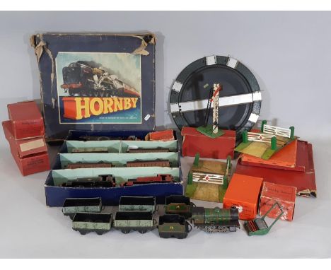 A collection of Hornby O gauge clockwork railway locomotives, wagons and track including boxed Tank Goods Set no 40 (with som