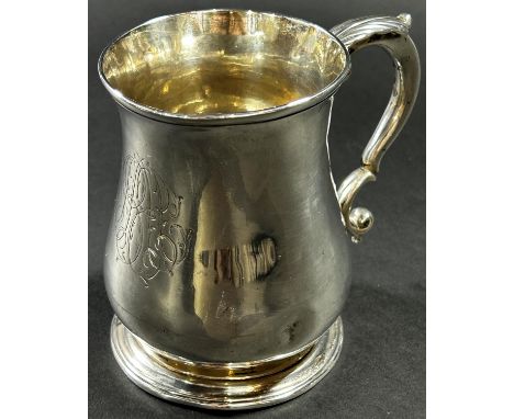 A George II silver baluster shaped tankard with scrolled handle, monogrammed London 1757, maker Thomas Whiphan and Charles Wr