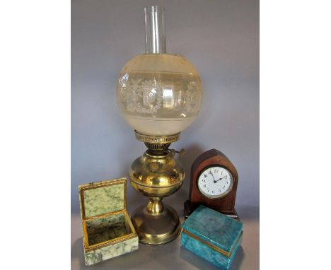 A 19th century brass oil lamp, a mahogany cased mantel clock and a blue and a grey marble cigarette box. 4 