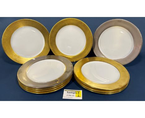 A large collection of Legle Limoges china wares comprising large dinner plates with thick gold or silver gilt bands, smaller 