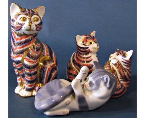 Three Royal Crown Derby ceramic cat figures together with a further Copenhagen example 