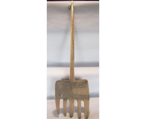 An antique wooden pitch fork with iron strapping repairs, 117cm long. 
