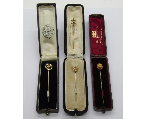 Four antique gold stick pins; 14k maple leaf example set with seed pearls (centre pearl vacant) contained in a E. Merman of V