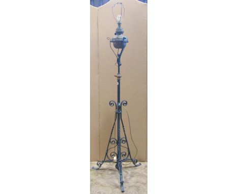 Telescopic iron oil lamp standard with scrolled detail, brass fittings and reservoir (later converted to electricity) 