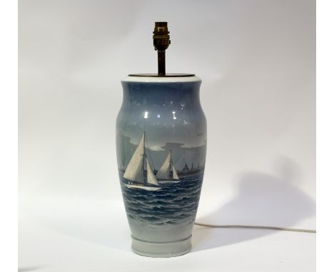 A Royal Copenhagen tall table lamp, body decorated with a seascape scene with sailboats and city to background. (marked verso