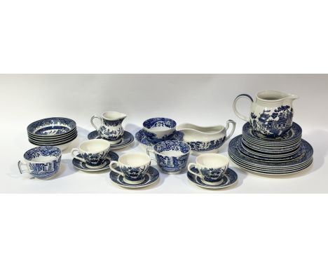 A Churchill Village Willow Georgian print part service comprising, a pitcher (h-13cm), six saucers (w-14cm), three teacups, a