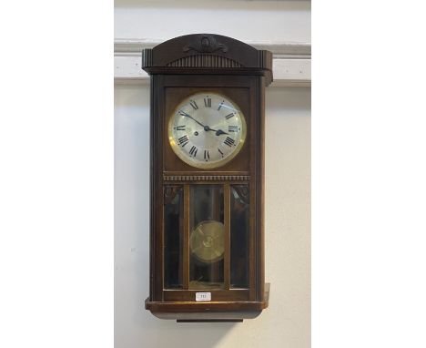 An early 20th century walnut cased Vienna style wall clock, the silvered dial having a Roman chapter ring, eight day twin tra