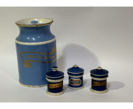 A collection of Chemist/ Apothecary jars and covers, one light blue large jar with band reading "Long Cut Brown" with cover (