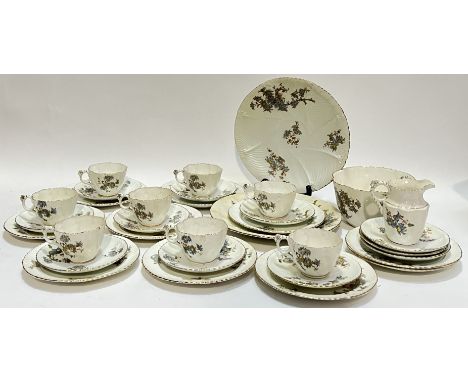 A gilt floral china part tea service comprising eight cups, eleven saucers, ten tea plates, two sandwich/desert plates (w- 25